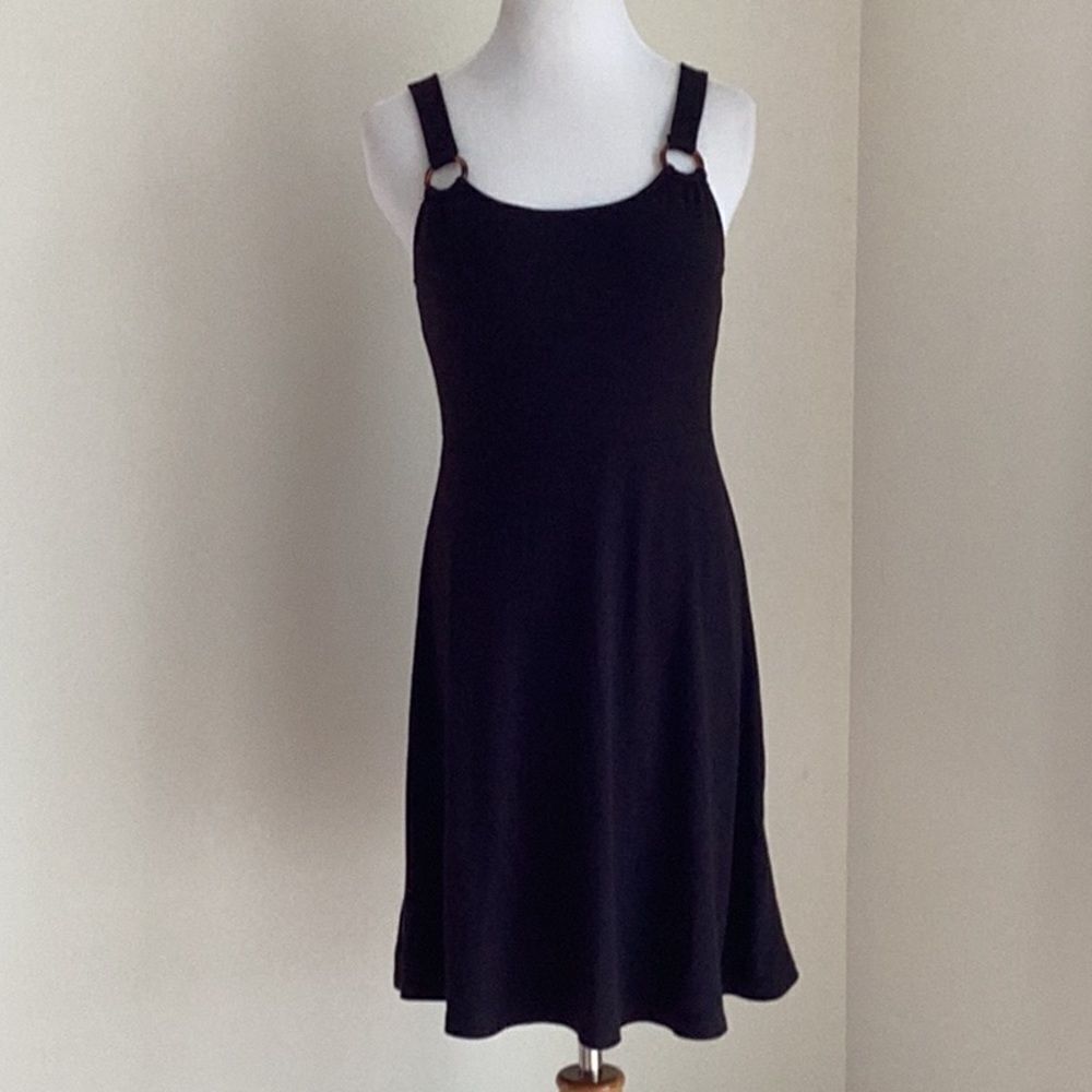 Black simple but cute dress with ring accents size Small above the knee